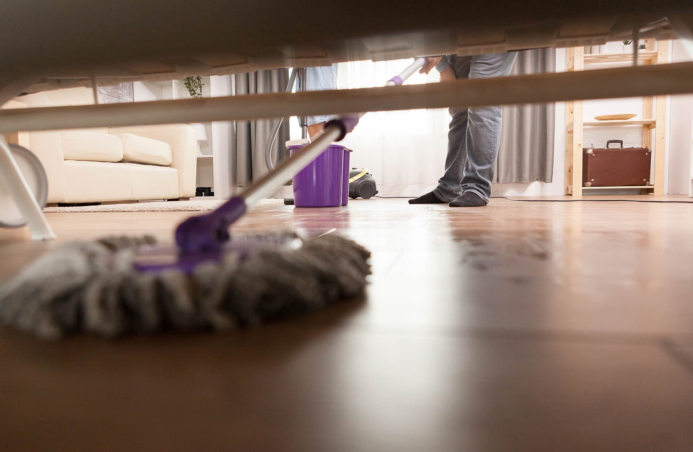 Dusting: A Game Plan residential &amp;amp;amp;amp; commercial cleaners blog - cleaning dust under sofa 6MHCRJX 2400 1 - Residential &#038; Commercial Cleaners Blog